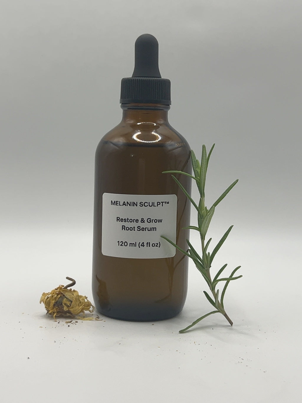 Restore & Grow Root Serum 4 fl oz bottle with rosemary