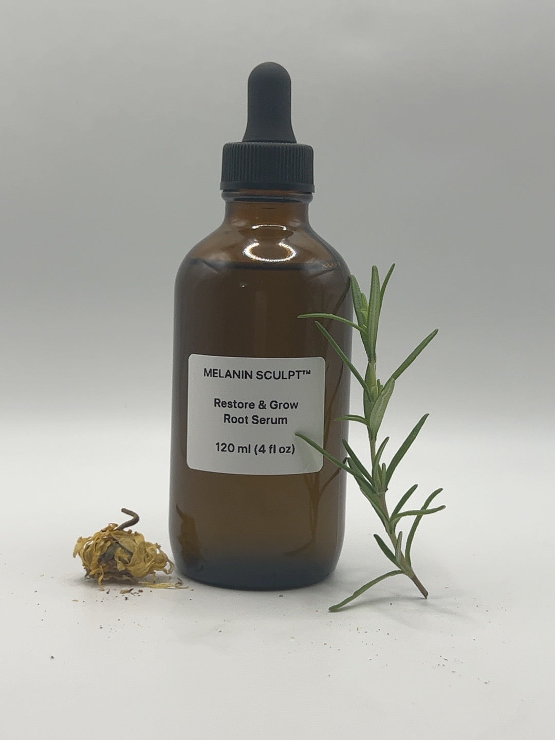 Restore & Grow Root Serum 4 fl oz bottle with rosemary